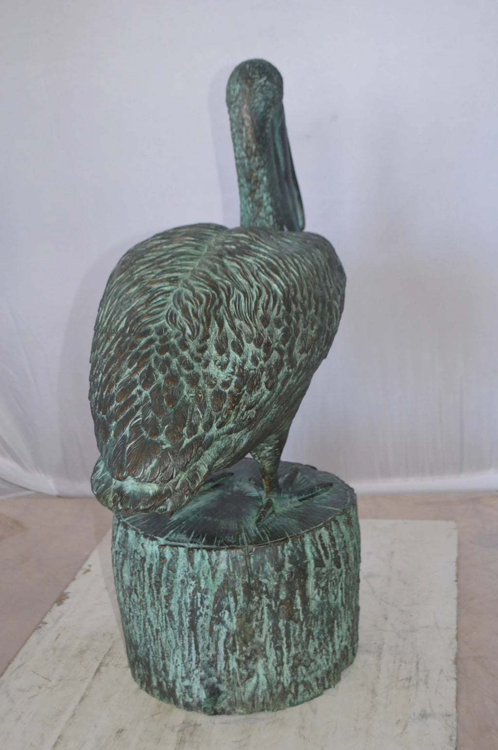 Nifao Pelican on a Tree Stump fountain bronze statue - Size: 30"L x 16"W x 46"H.